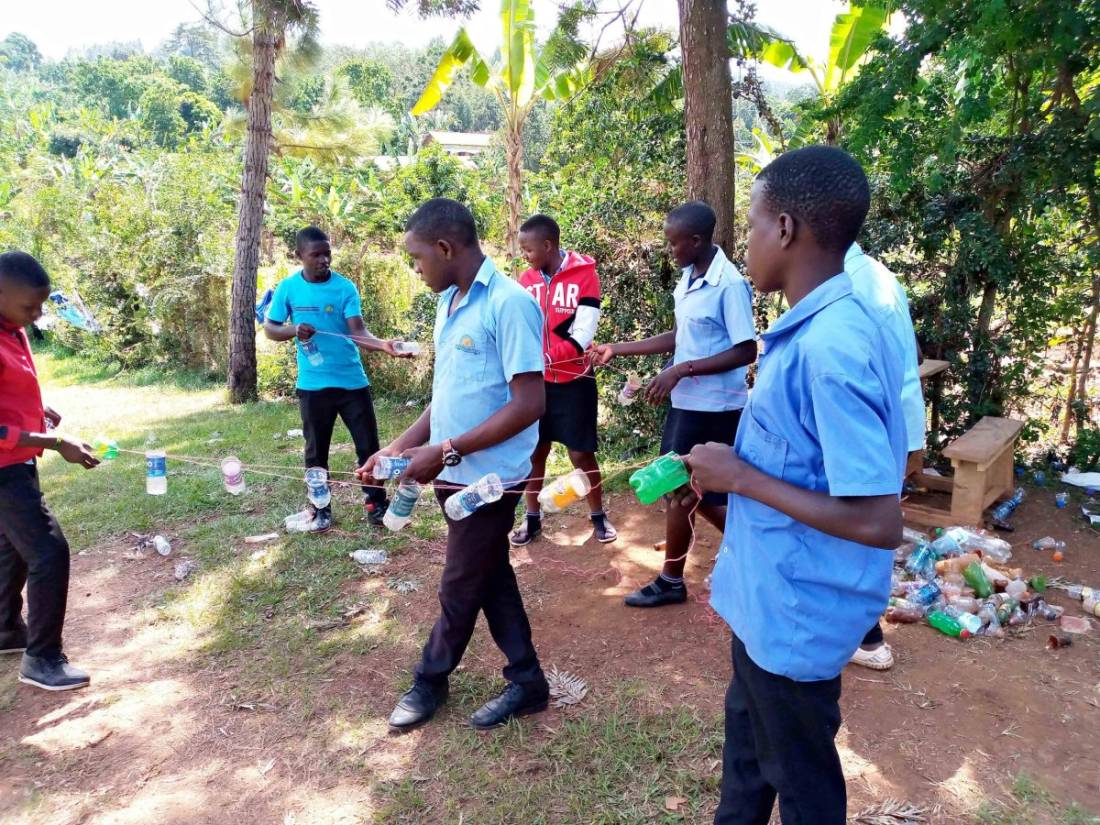 WENET team with children in a partner school classroom in Uganda